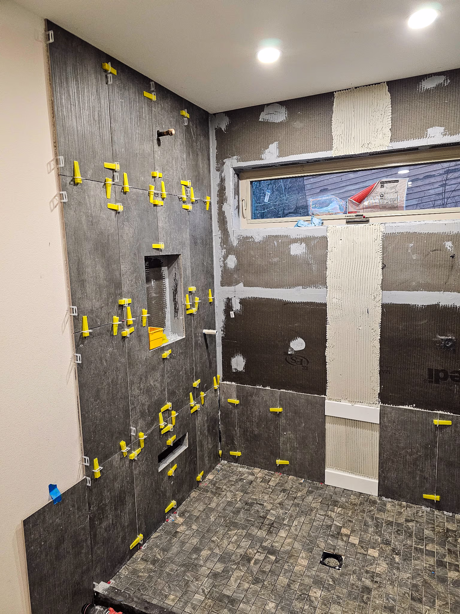 a bathroom getting tiled
